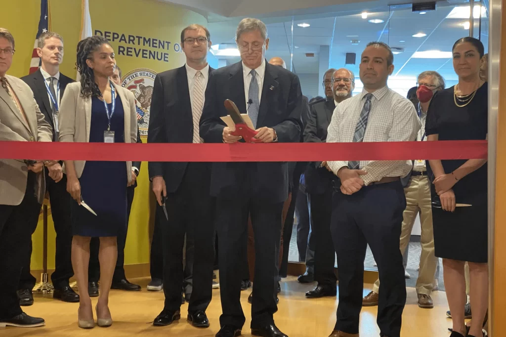 Ayse and Anthony Participating in Ribbon Cutting Ceremony